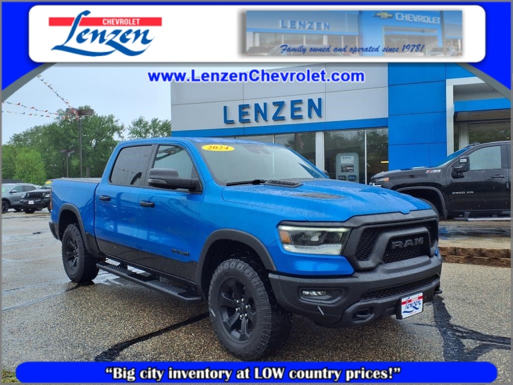 2024 RAM 1500 Rebel Crew Cab 4x4 5'7" Box in Blue — front three-quarter view