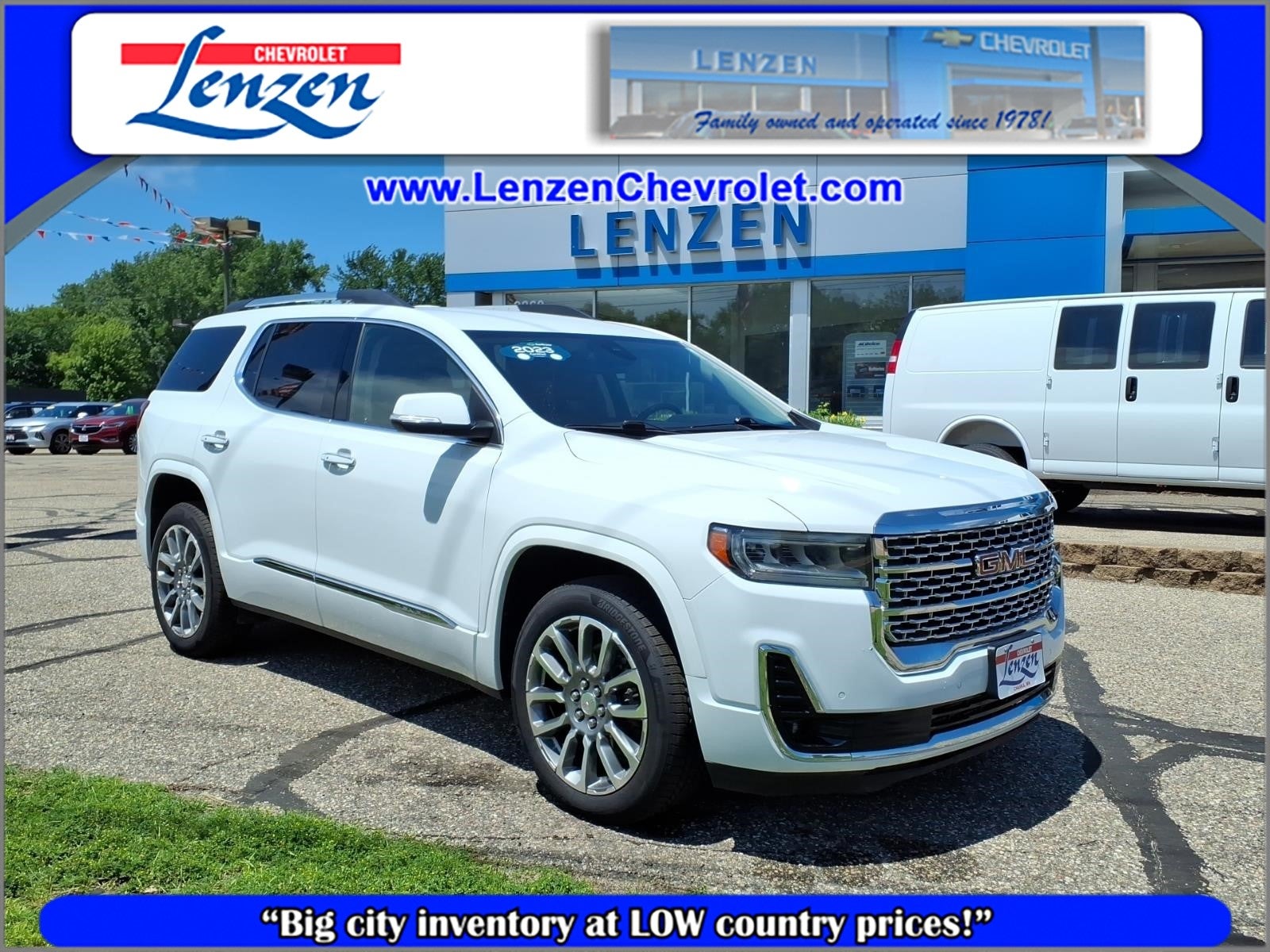 2023 GMC Acadia Denali in Summit White — front three-quarter view